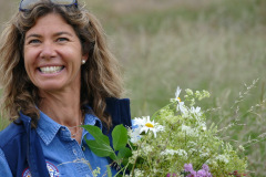 Heather McHutshison (BOS) bringing flowers to the maypole